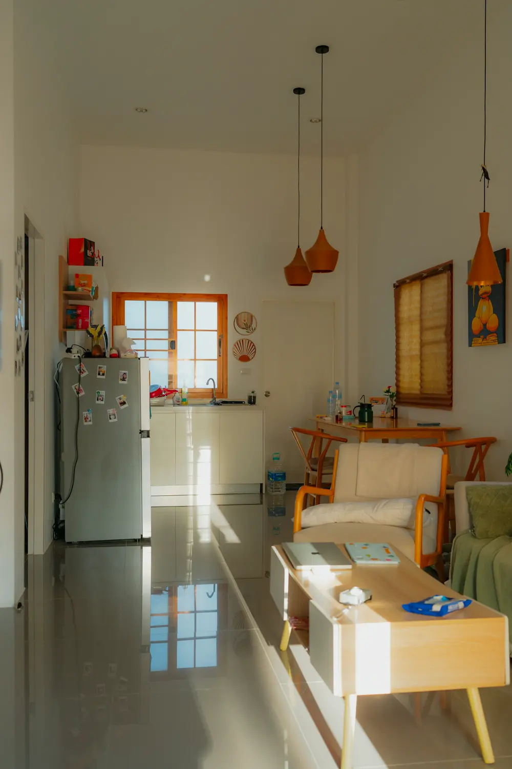 Bright living room opening to a dining table